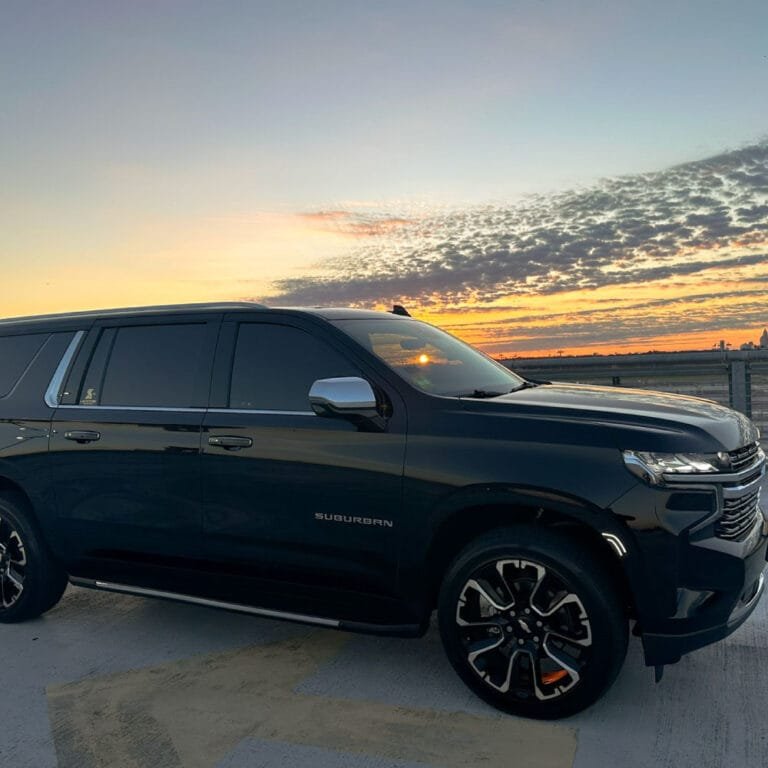 Black Chevrolet Suburban at sunset