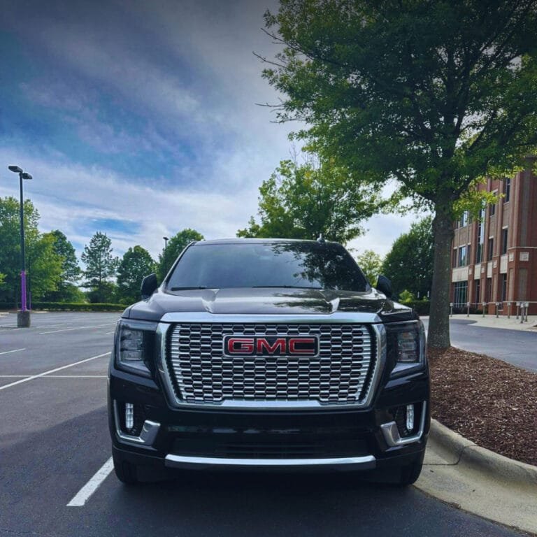 Black GMC Yukon Denali ready for a chauffeur pickup in Charlotte