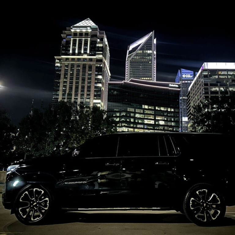 Black SUV at night in Uptown Charlotte