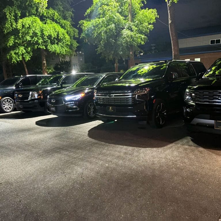 Row of black SUVs lined up for a group transfer