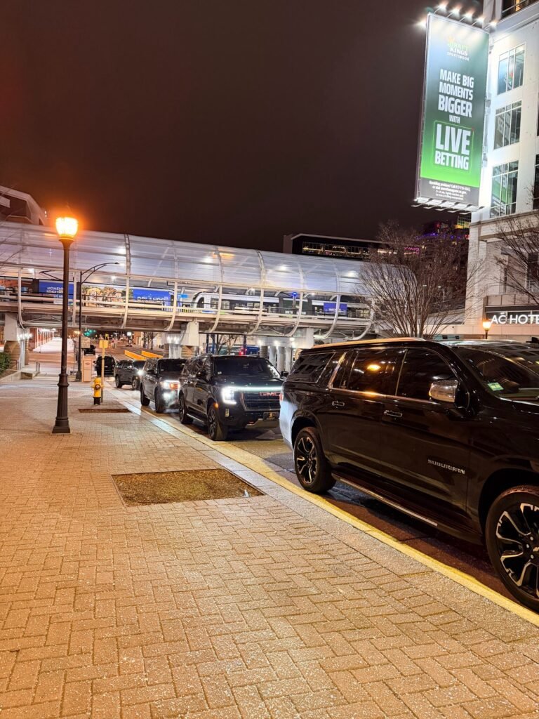 Black Chevrolet Suburban waiting at a pickup curb in Charlotte